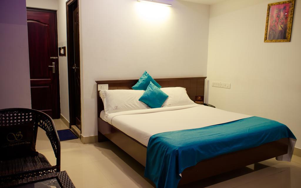 The Signature Inn Bengaluru Szoba fotó